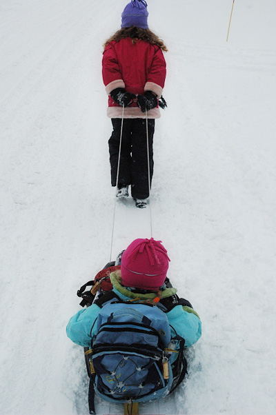 Emma pulls the sled